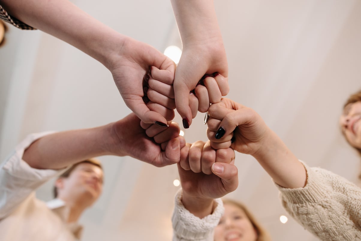 Group of People with Clenched Fists Showing Support